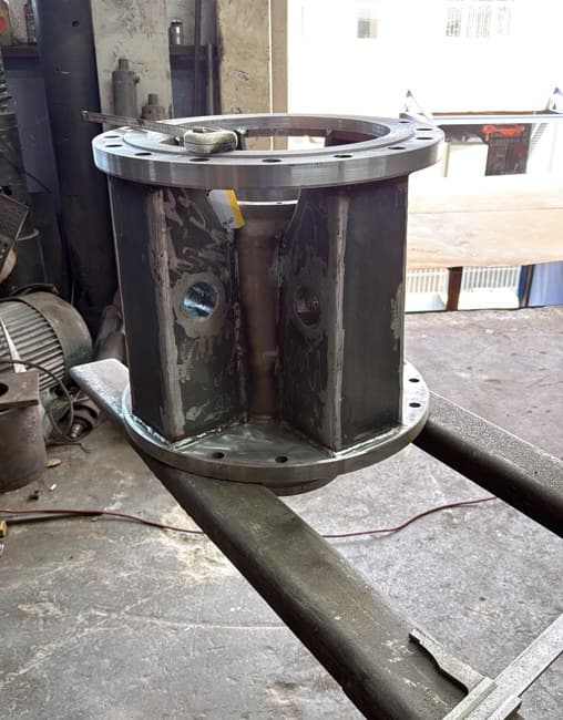 A flanged body assembly with welded stiffeners